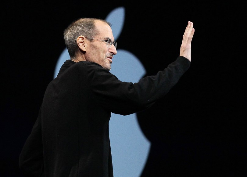 SAN FRANCISCO, CA - JUNE 06: Apple CEO Steve Jobs waves as he delivers the keynote address at the 2011 Apple World Wide Developers Conference at the Moscone Center on June 6, 2011 in San Francisco, California. Apple CEO Steve Jobs returned from sick leave to introduce Apple's new iCloud storage system and the next versions of Apple's iOS and Mac OSX. (Photo by Justin Sullivan/Getty Images)