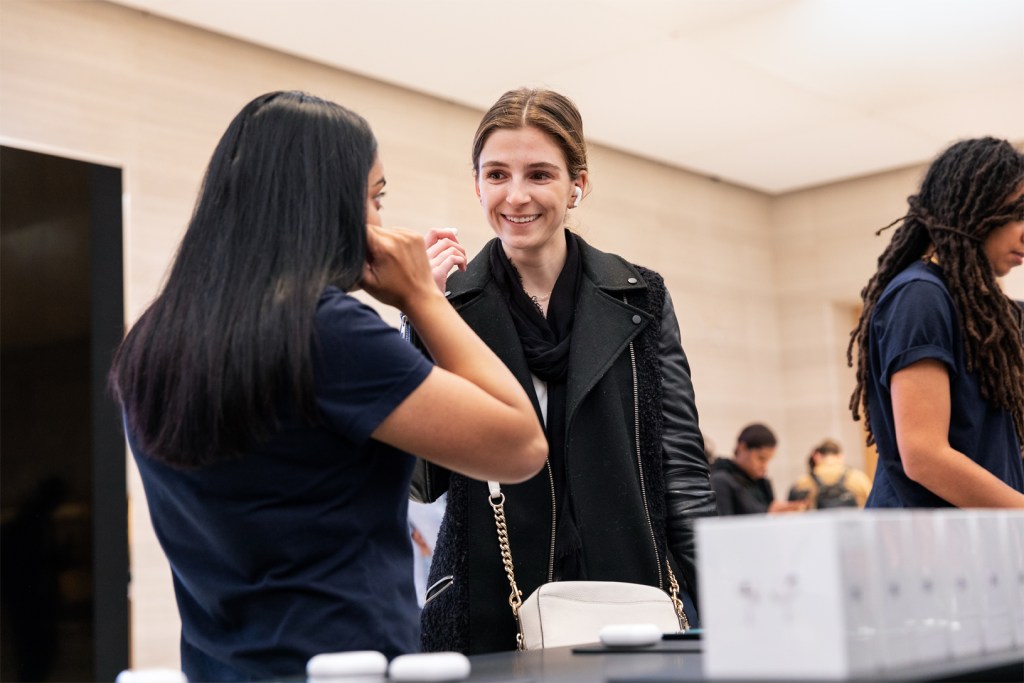 apple airpod pro launch ny woman trying airpods pro 10302019 big.jpg.large 2x