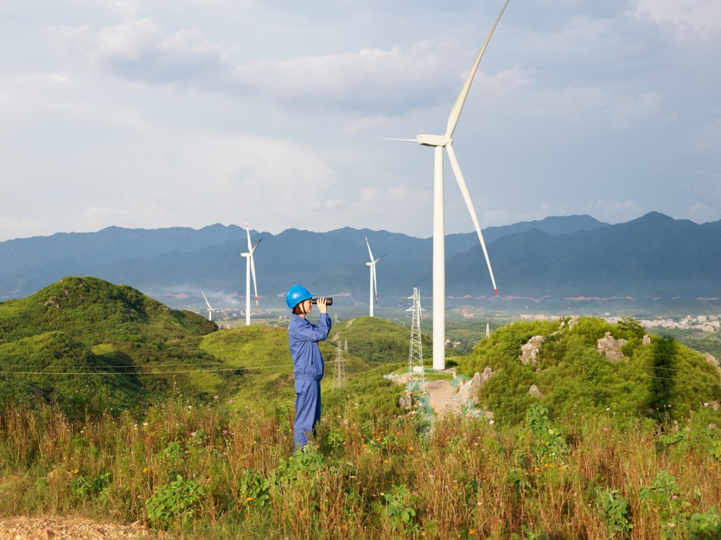 china clean energy fund invests in wind farms team member looking across landscape 082619 big.jpg.large 2x