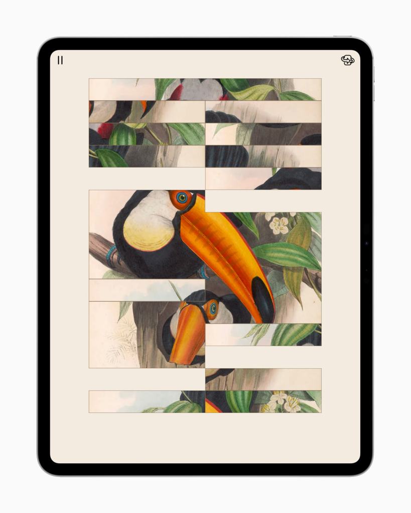Apple, 2025 Apple 디자인 어워드 수상작 공개 10 An iPad displaying a puzzle featuring a toucan surrounded by foliage, with pieces arranged in a grid layout.