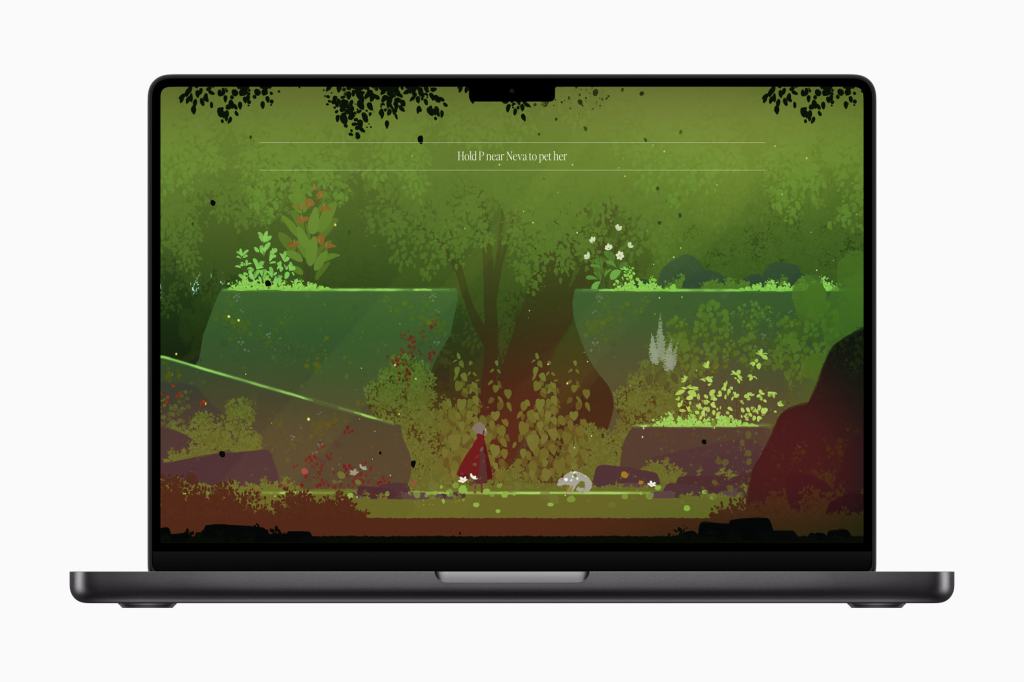 Apple, 2025 Apple 디자인 어워드 수상작 공개 12 A screenshot of a video game displayed on a laptop, featuring a vibrant green forest scene with various plants and rocks, as well as a character in a red cloak interacting with the environment.