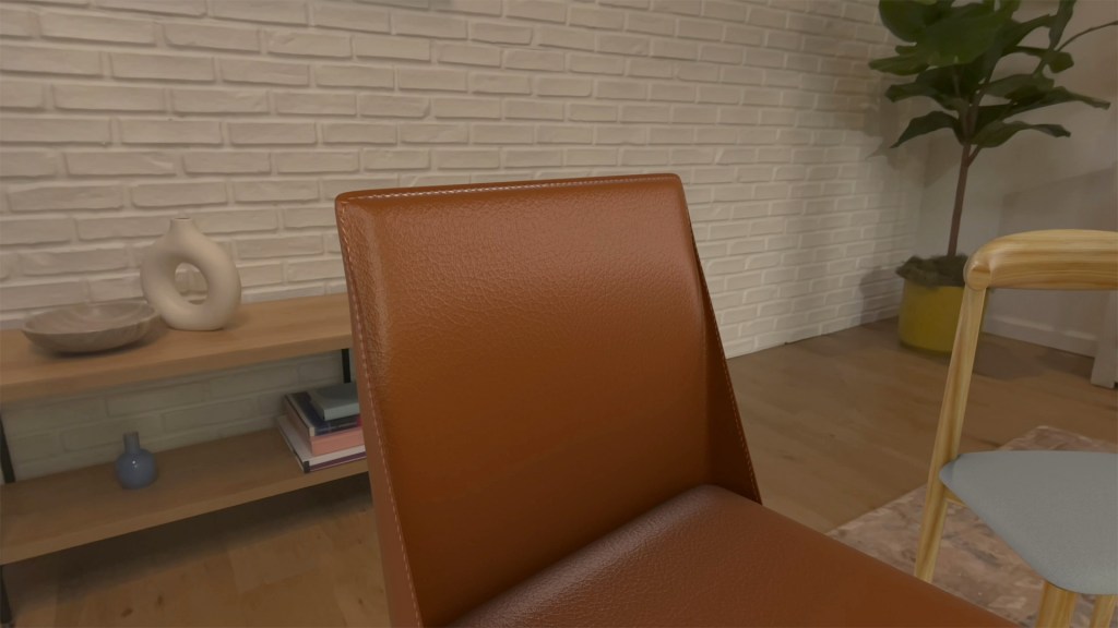Apple, 2025 Apple 디자인 어워드 수상작 공개 7 Close-up view of a modern brown chair in a stylish interior with a light-colored brick wall, a wooden shelf, decorative objects, and a leafy plant.