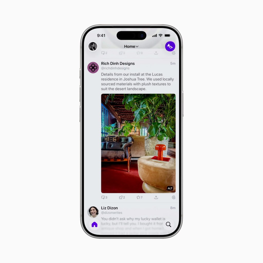 An iPhone displaying a social media feed with a post about interior design, featuring a colorful sofa and houseplants in a stylish setting.