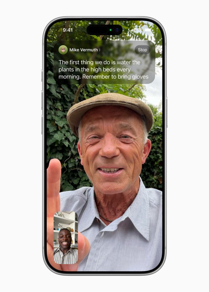 A person on a video call is seen holding a phone, with a message from a contact visible on the screen, and behind them is a garden setting.