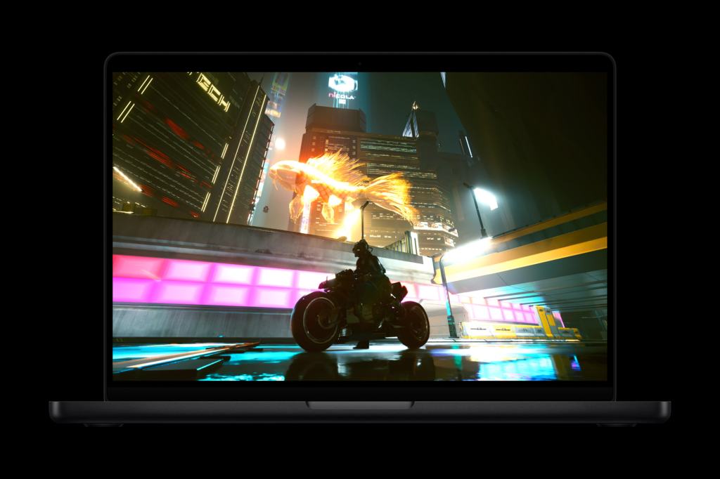A futuristic cityscape displayed on a laptop screen, featuring a character on a motorcycle against vibrant neon lights and tall buildings.