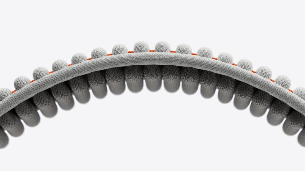 Apple Vision Pro의 듀얼 니트 밴드의 디자인, 입체적으로 직조된 구조와 그레이 색상으로 강조된 편안한 쿠션감.