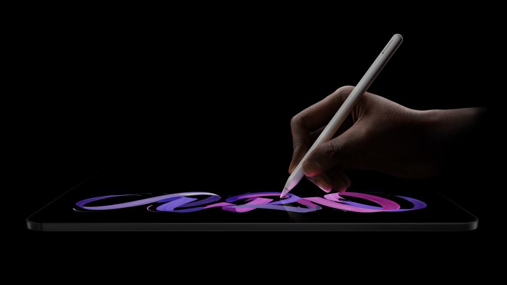 Apple, M5 칩을 탑재한 혁신적인 iPad Pro 발표 12 A close-up of a hand using an Apple Pencil on an iPad display, showcasing vibrant digital artwork.