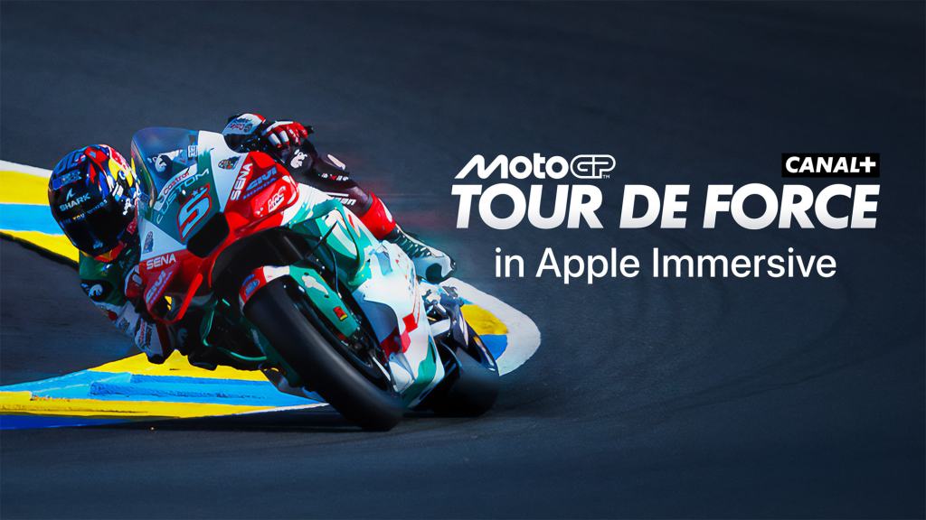 MotoGP Tour De Force in Apple Immersive promotional image featuring a motorcycle racer leaning into a curve on a racetrack.