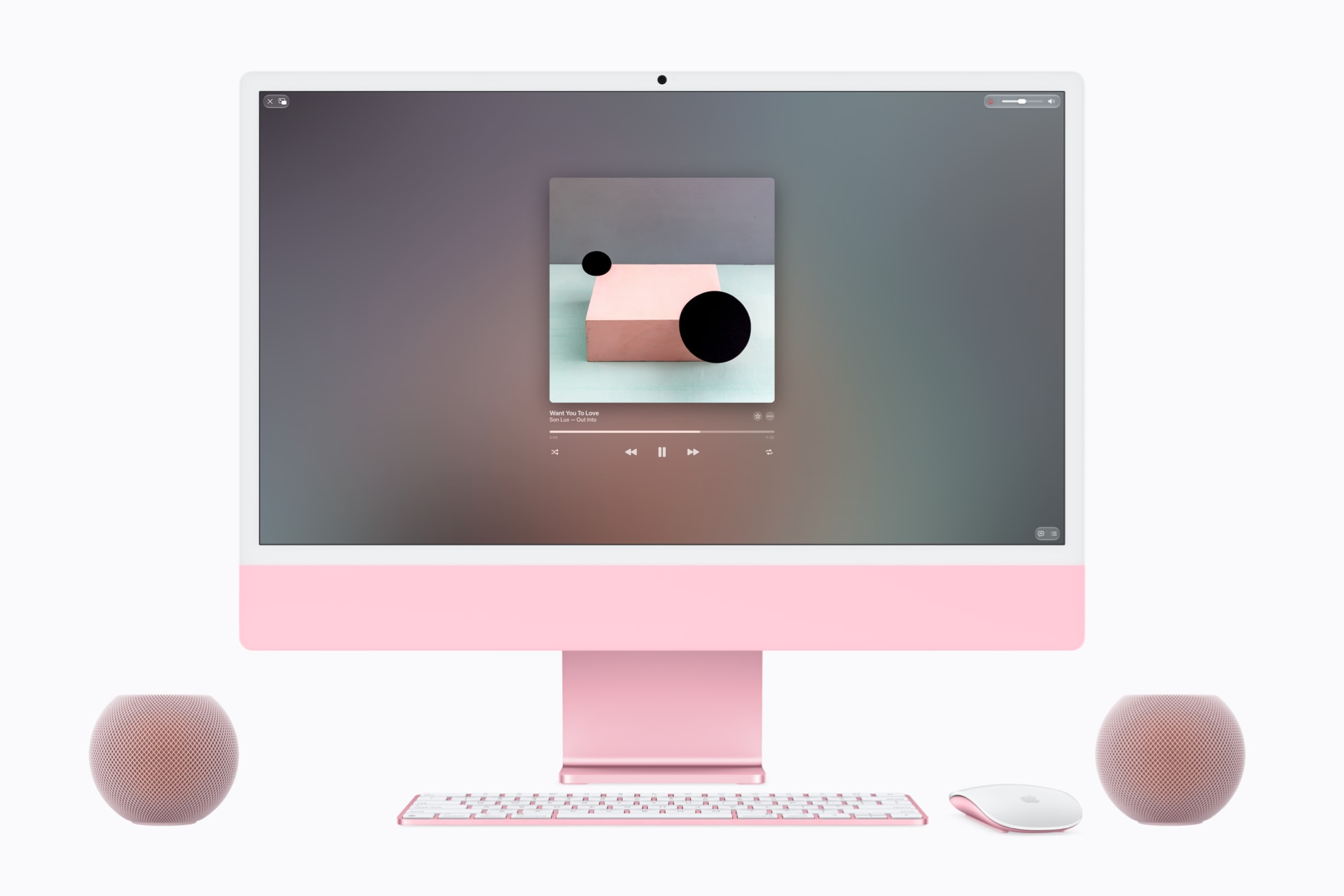 iMac과 함께 배치된 핑크색 HomePod mini 2